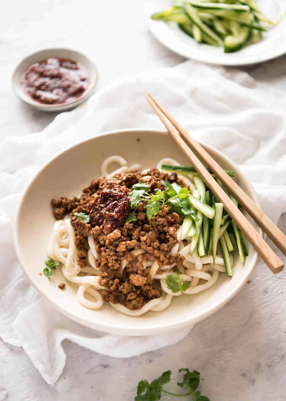 Chinese Pork Mince with Noodles (Zha Jiang Mian) - Super quick and super tasty, affectionally known as "Chinese Bolognese". The pork is savoury with a touch of heat and spice, perfect mixed through noodles! www.recipetineats.com
