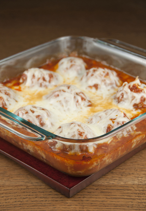 A twist on chicken parmesan in the form of cheese meatballs with tomato sauce made in the oven. Easy but special enough to serve for a special occasion or dinner guests.