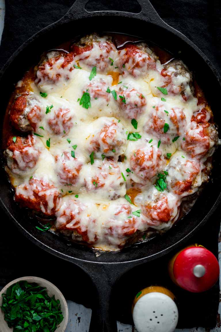 oven baked meatballs with parmesan in a skillet