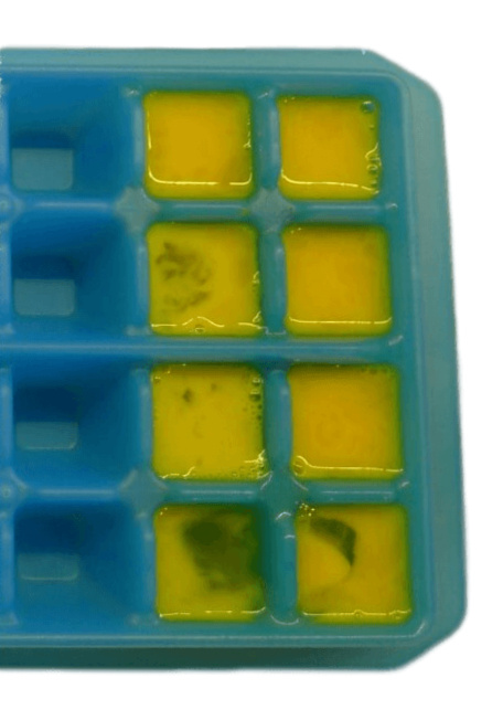 Freezing eggs in an ice cube tray.